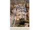 Aerial view of new construction homes with a street view and surrounding trees at 1628 Ferncliff Rd, Charlotte, NC 28211