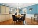Elegant dining room with built-in cabinets, hardwood floors, and a chandelier at 16614 Beech Hill Dr, Huntersville, NC 28078