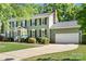 Charming two-story home with a well-maintained lawn, a two-car garage, and a traditional design at 16614 Beech Hill Dr, Huntersville, NC 28078