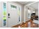 Foyer with hardwood floors, decorative glass door panels, and natural light at 16614 Beech Hill Dr, Huntersville, NC 28078