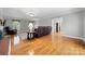 Bright living room with hardwood floors, brick fireplace, and comfortable seating at 16614 Beech Hill Dr, Huntersville, NC 28078