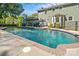 An inviting in-ground swimming pool, black metal fence, and home exterior enhance this property's appeal at 16614 Beech Hill Dr, Huntersville, NC 28078
