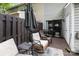 Back patio features outdoor seating, a rug, and a grill for a private and relaxing outdoor space at 1766 Forest Side Ln, Charlotte, NC 28213