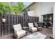 Back patio features outdoor seating, a rug, and a grill for a private and relaxing outdoor space at 1766 Forest Side Ln, Charlotte, NC 28213