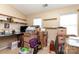 Bedroom with neutral walls, floating shelves, and natural light is currently staged with moving boxes and other items at 1766 Forest Side Ln, Charlotte, NC 28213