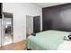 Comfortable bedroom featuring neutral walls, carpet, and access to an en-suite bathroom at 1766 Forest Side Ln, Charlotte, NC 28213