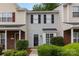 Well-kept townhouse exterior with shutters and manicured shrubs at 1766 Forest Side Ln, Charlotte, NC 28213