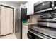 Modern kitchen with stainless steel appliances, and white cabinets, plus a utility closet with stacked washer/dryer at 1766 Forest Side Ln, Charlotte, NC 28213