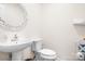 Cozy powder room featuring a modern vanity, mirror, and fixtures for guests at 1849 Meadow Crossing Dr # 118, Huntersville, NC 28078