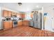 Functional kitchen with stainless steel appliances, wood cabinets, and ample counter space at 1849 Meadow Crossing Dr # 118, Huntersville, NC 28078