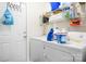 Functional laundry room with modern appliances and storage shelves at 1849 Meadow Crossing Dr # 118, Huntersville, NC 28078