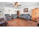 Inviting living room with hardwood floors, ceiling fan, and a cozy atmosphere at 1849 Meadow Crossing Dr # 118, Huntersville, NC 28078