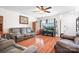 Spacious living room with hardwood floors, neutral walls, and a large window for natural light at 1849 Meadow Crossing Dr # 118, Huntersville, NC 28078