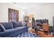 Comfortable living room with a sofa, desk and workspace, perfect for relaxation and productivity at 1849 Meadow Crossing Dr # 118, Huntersville, NC 28078
