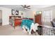 Bright main bedroom with a ceiling fan, large dresser, and lots of natural light at 1849 Meadow Crossing Dr # 118, Huntersville, NC 28078