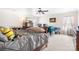 Bright and airy main bedroom with a ceiling fan, TV, and neutral decor for a tranquil retreat at 1849 Meadow Crossing Dr # 118, Huntersville, NC 28078