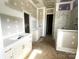 Bathroom showcases dual vanities, and a tiled shower-bathtub with marble accents at 19044 Newburg Hill Rd, Davidson, NC 28036