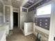 Bathroom features a tiled shower-bathtub with marble accents and bright vanity at 19044 Newburg Hill Rd, Davidson, NC 28036