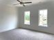 Bright and airy bedroom with plush carpeting and natural light at 19044 Newburg Hill Rd, Davidson, NC 28036