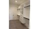 Spacious walk-in closet with custom shelving and drawers for optimal storage at 19044 Newburg Hill Rd, Davidson, NC 28036
