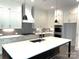 Stylish kitchen features quartz countertops, stainless steel appliances, and a central island at 19044 Newburg Hill Rd, Davidson, NC 28036
