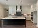 Beautiful kitchen featuring an island, designer finishes, and modern appliances at 19044 Newburg Hill Rd, Davidson, NC 28036