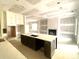 Spacious kitchen with a center island, custom cabinets, fireplace, and expansive layout for modern living and entertaining at 19044 Newburg Hill Rd, Davidson, NC 28036