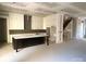 Spacious unfinished kitchen with a large center island, white cabinets, and modern layout awaiting your personal touches at 19044 Newburg Hill Rd, Davidson, NC 28036