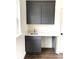 Modern kitchenette with gray cabinets, gold hardware, and a bright quartz countertop at 19044 Newburg Hill Rd, Davidson, NC 28036