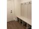 Functional mudroom with built-in bench, coat hooks, and storage for organization at 19044 Newburg Hill Rd, Davidson, NC 28036