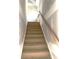 Staircase with wooden steps and handrail leading upwards to the second floor at 19044 Newburg Hill Rd, Davidson, NC 28036