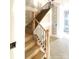 Classic staircase with wooden steps, modern railings, and natural light at 19044 Newburg Hill Rd, Davidson, NC 28036