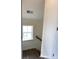 Bright stairway landing featuring wood treads and a window letting in natural light at 19044 Newburg Hill Rd, Davidson, NC 28036