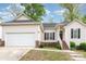 Charming single-story home featuring a well-maintained lawn and an attached two-car garage at 2068 Samantha Dr, Kannapolis, NC 28083