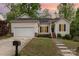 Charming single-story home featuring a well-maintained lawn and an attached two-car garage at 2068 Samantha Dr, Kannapolis, NC 28083