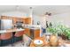 Open-concept kitchen with wooden cabinetry, stainless steel appliances and a center island with seating at 2068 Samantha Dr, Kannapolis, NC 28083