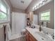 Bright bathroom with a shower-tub combo, vanity, and good natural lighting at 215 6Th St, Belmont, NC 28012