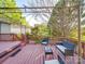 Backyard deck with a pergola, seating area, and stairs leading to a landscaped yard for outdoor enjoyment at 215 6Th St, Belmont, NC 28012
