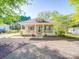 Charming single-story home with inviting front porch, manicured landscaping, and neutral exterior paint at 215 6Th St, Belmont, NC 28012
