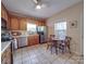 Charming kitchen with wooden cabinets, stainless steel appliances, and a cozy breakfast nook at 215 6Th St, Belmont, NC 28012