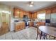 Kitchen with updated stainless steel appliances, oak cabinets and a dining table at 215 6Th St, Belmont, NC 28012