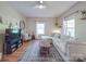 Cozy living room with a large sectional couch, woven coffee table, and decorative rug at 215 6Th St, Belmont, NC 28012