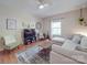 Bright living room featuring hardwood floors, a comfortable sofa, and stylish decor at 215 6Th St, Belmont, NC 28012