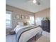 Serene main bedroom featuring two large windows, a comfortable bed, and a dresser at 215 6Th St, Belmont, NC 28012