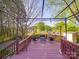 Relaxing outdoor pergola featuring a seating area, ideal for entertaining or enjoying the fresh air in a backyard oasis at 215 6Th St, Belmont, NC 28012