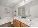 Bright bathroom features a double sink vanity, soaking tub, and a separate shower at 2624 St Helena Ct, Fort Mill, SC 29715