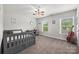 Well-lit bedroom featuring neutral walls, carpet, and a ceiling fan at 2624 St Helena Ct, Fort Mill, SC 29715