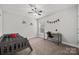 Comfortable bedroom with carpet, neutral walls, and a ceiling fan at 2624 St Helena Ct, Fort Mill, SC 29715
