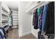 Well-organized walk-in closet with ample hanging space and shelving units at 2624 St Helena Ct, Fort Mill, SC 29715