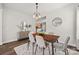 Dining room showcasing modern light fixture, stylish furniture, and hardwood flooring at 2624 St Helena Ct, Fort Mill, SC 29715